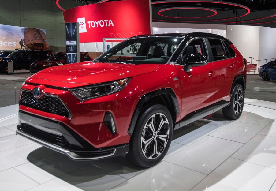 A red RAV4 Prime at an auto show