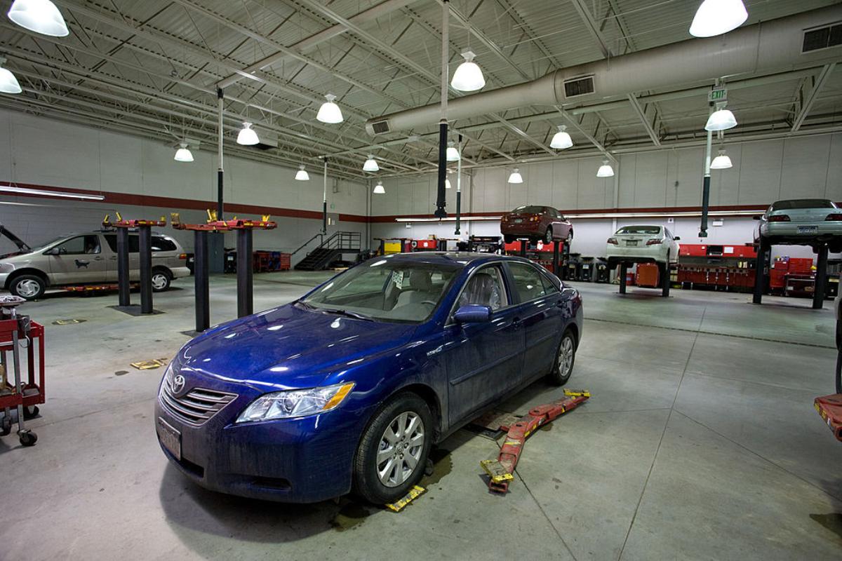 A car getting an oil change at a Toyota service station.