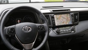 Infotainment system, one of the car features, displaying road navigation map