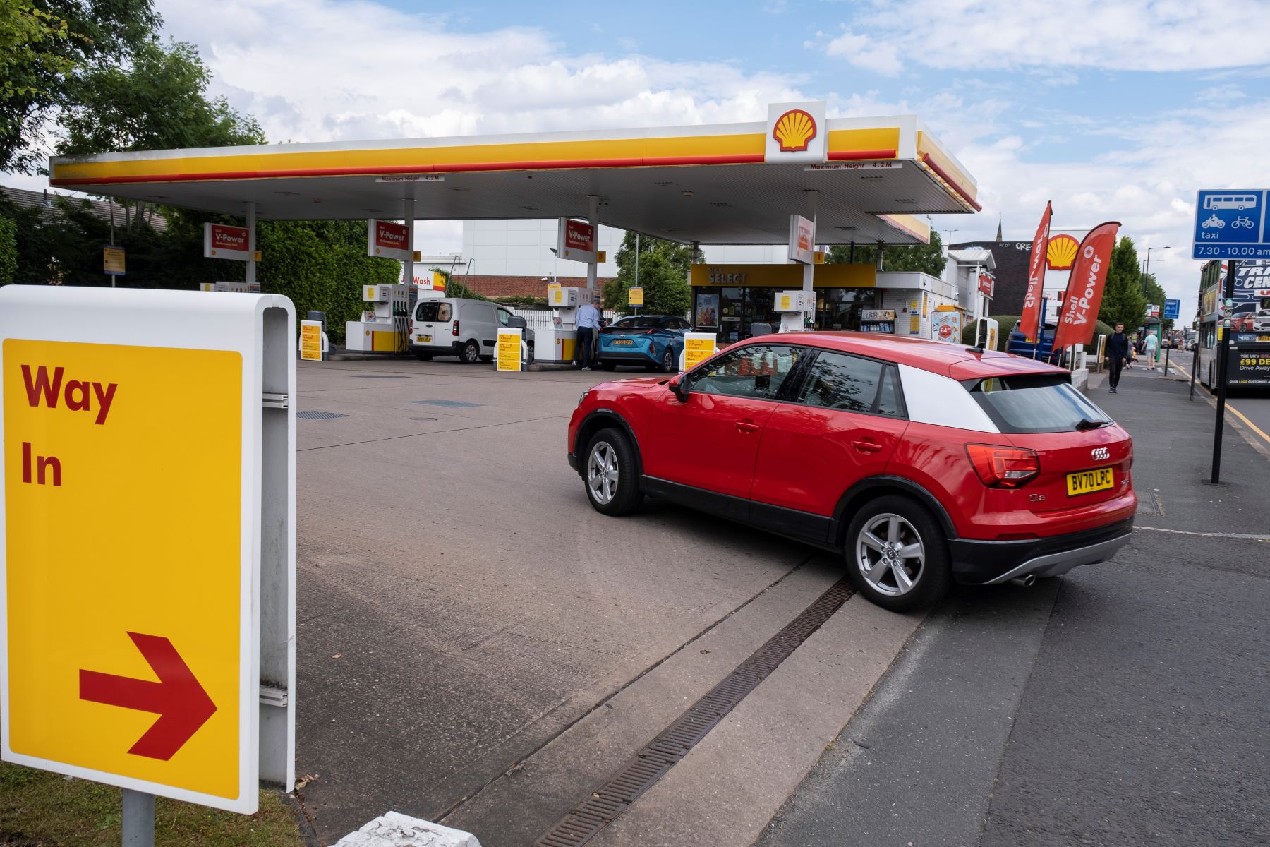 A car driving into a petrol/gas station in Birmingham, United Kingdom (U.K.)