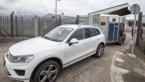 An SUV towing a box trailer, which could be what you can tow with a 4,000 pound towing capacity limit.