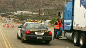 A highway road rage incident closure due to a gun shooting stopping trucker traffic near Wrightwood, California