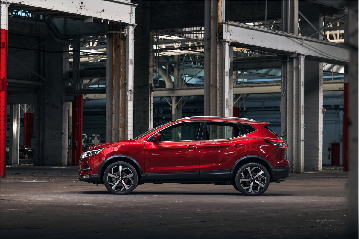 2021 Nissan Rogue Sport in red in a warehouse