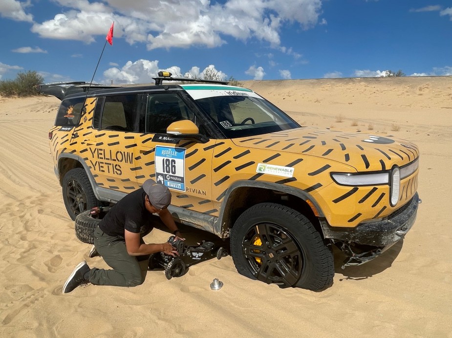 2022 Rivian R1S getting its tire changed