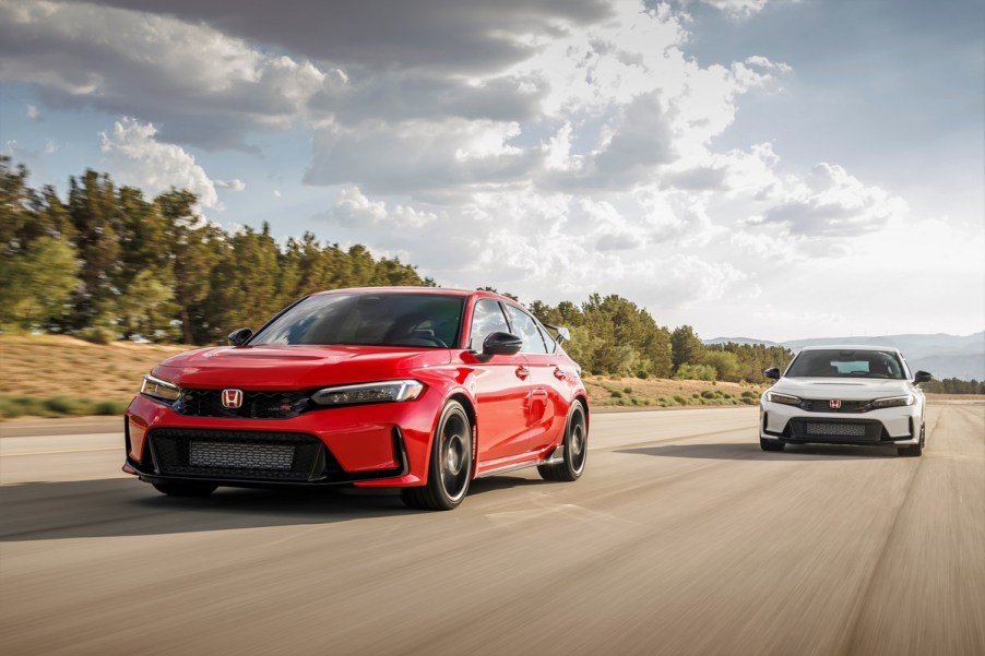 A pair of 2023 Civic Type Rs on a race track