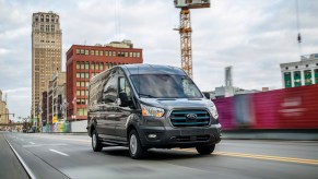 A 2023 E-Transit Cargo Van Cost a hefty price, parked in a city environment.