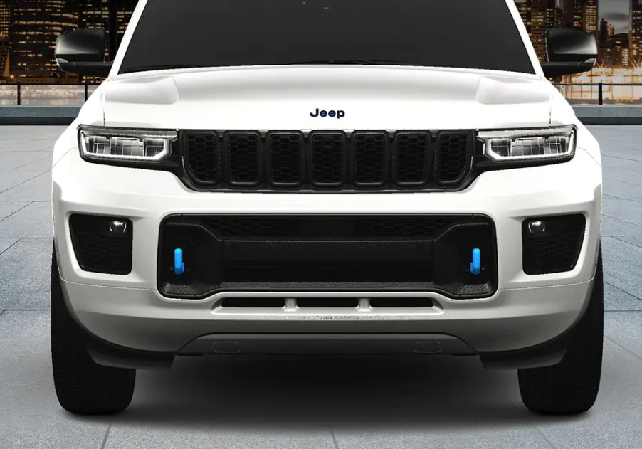 A white 2023 Jeep Grand Cherokee 4xe30th Anniversary Edition is shown in direct front view