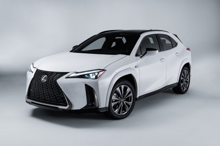 A white 2023 Lexus UXh in a white room, a great 2023 Lexus SUV. 