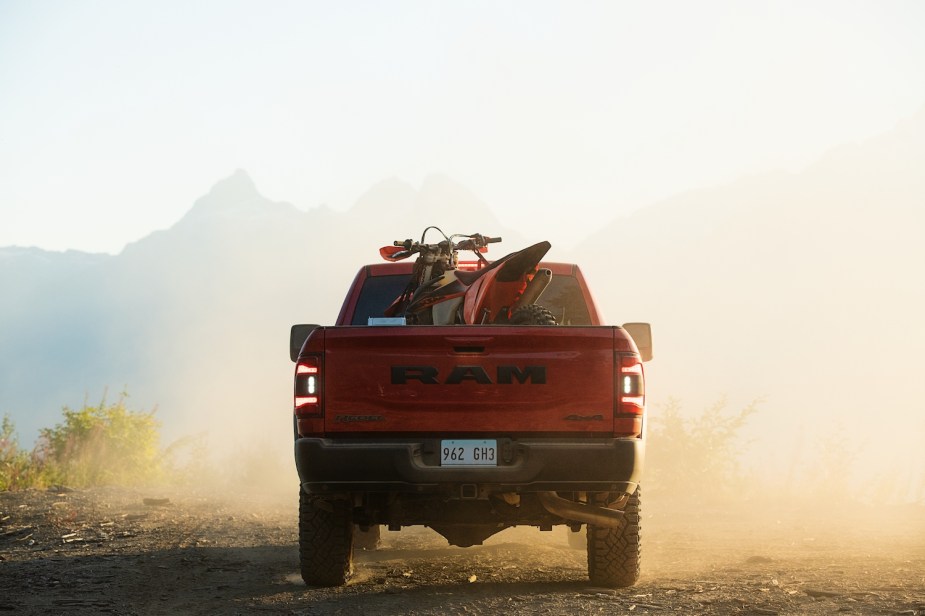 Promo photo of a Ram 2500 Rebel pickup truck hauling a dirt bike.