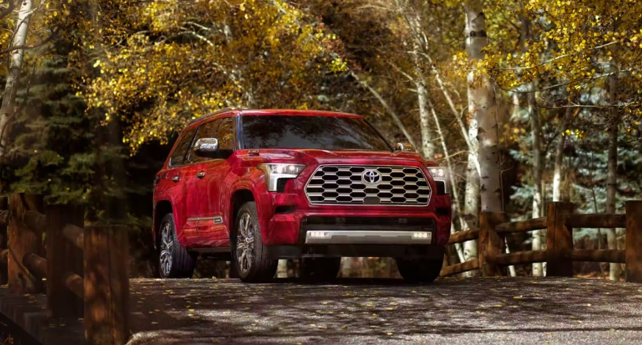 A red 2023 Toyota Sequoia full-size SUV is parked outdoors. 