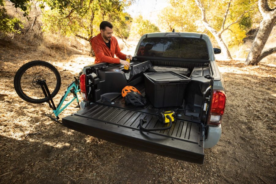 A Toyota Tacoma with bicycles and tools in the bed