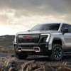 The 2025 GMC Sierra EV truck in silver on dirt