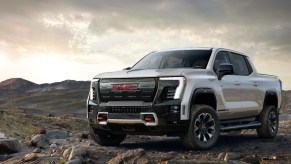 The 2025 GMC Sierra EV truck in silver on dirt