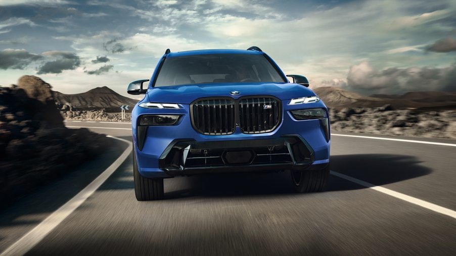 A blue 2023 BMW X7 three-row SUV drives on a road during the day. What's new with it?