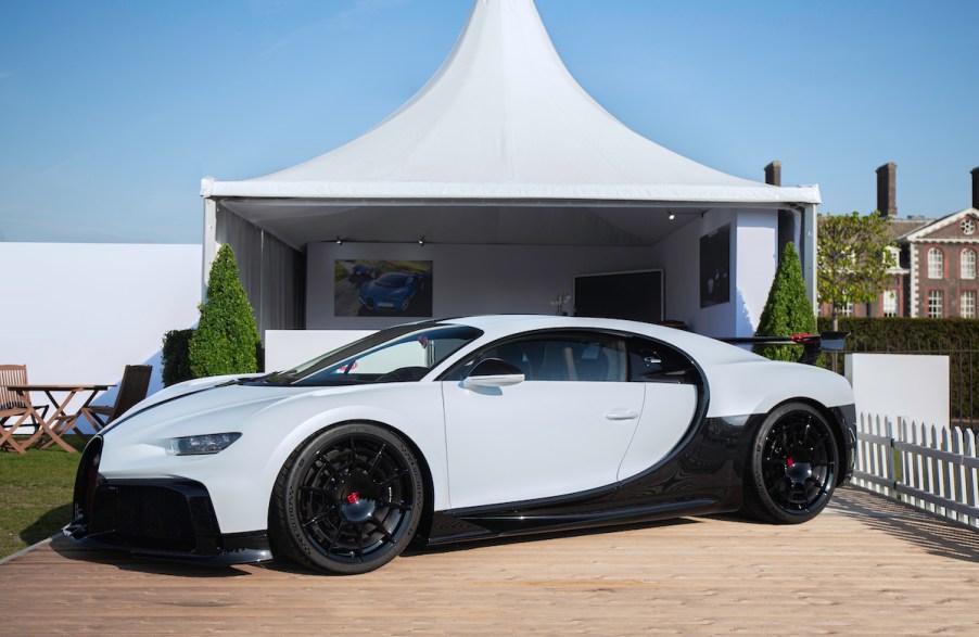 A white Bugatti Chiron Pur Sport, one of the least fuel efficient cars, parked outdoors.