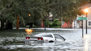 A car sits in floodwater after Hurricane Ian.