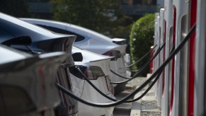 A row of EVs gaining additional driving range by charging.