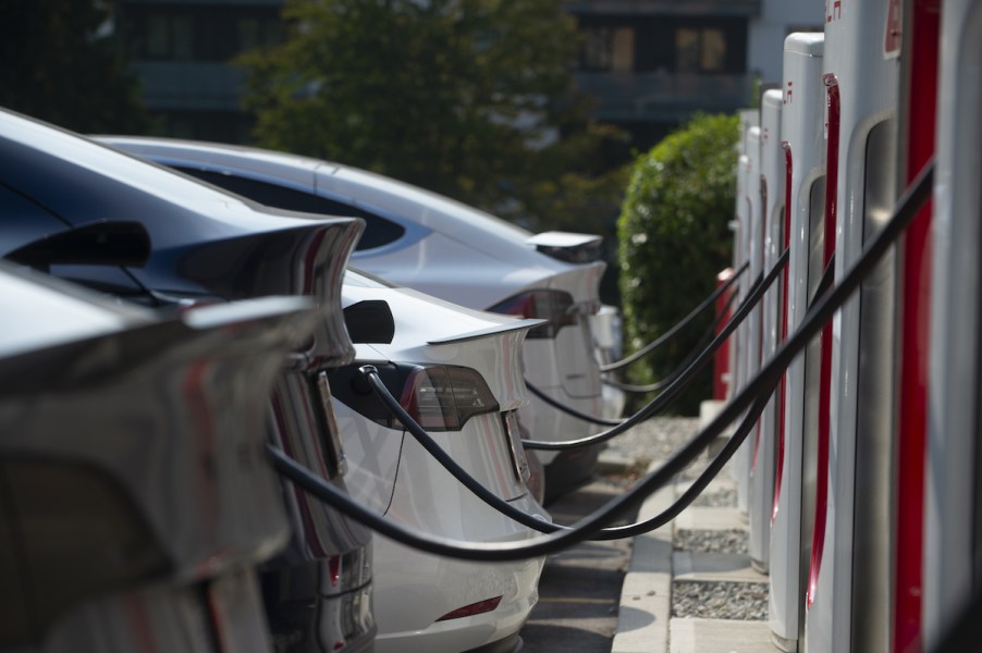 A row of EVs gaining additional driving range by charging.