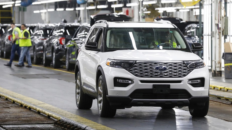 A white Ford Explorer, which is a great hybrid SUV. 