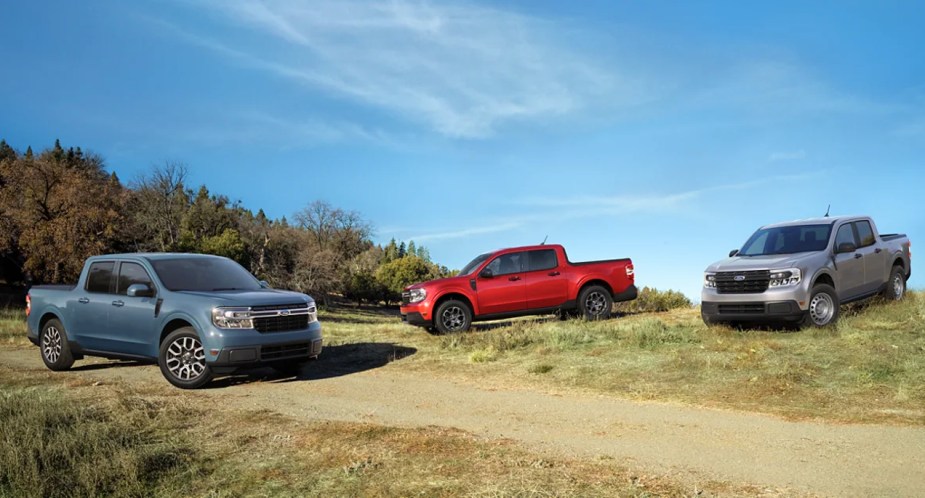 Three Ford Maverick small pickup trucks are parked outdoors. 