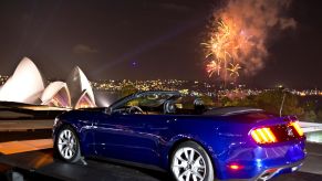 A blue Ford Mustang muscle car parked on New Year's Eve in Sydney, Australia