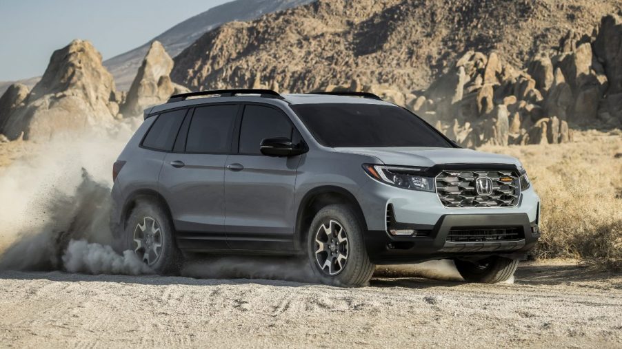 Front angle view of Sonic Gray Pearl 2023 Honda Passport midsize SUV