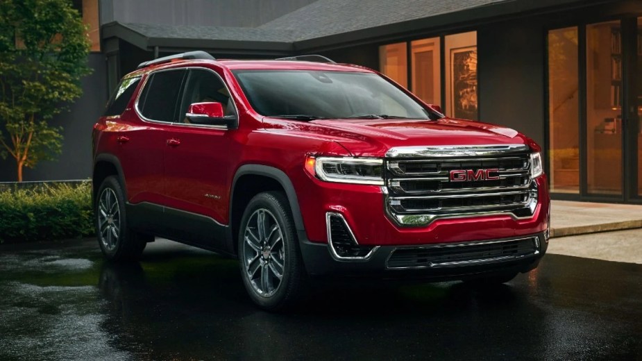 Front angle view of Volcanic Red Tintcoat 2023 GMC Acadia