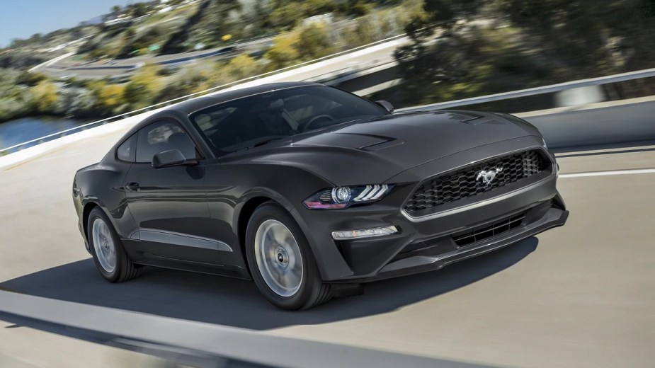 Front angle view of gray 2022 Ford Mustang, affordable sports car with high fuel economy