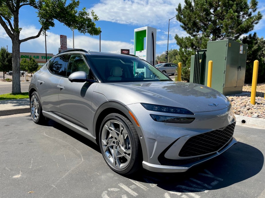 A 2023 Genesis GV60 plugged into a charger