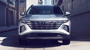 A gray 2023 Hyundai Tucson small SUV is parked.