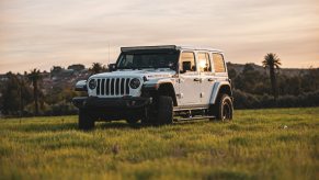 A white Jeep Wrangler SUV parked outdoors