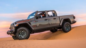 A 2023 Jeep Gladiator Mojave shows off its capability in a desert as a mid-size truck.