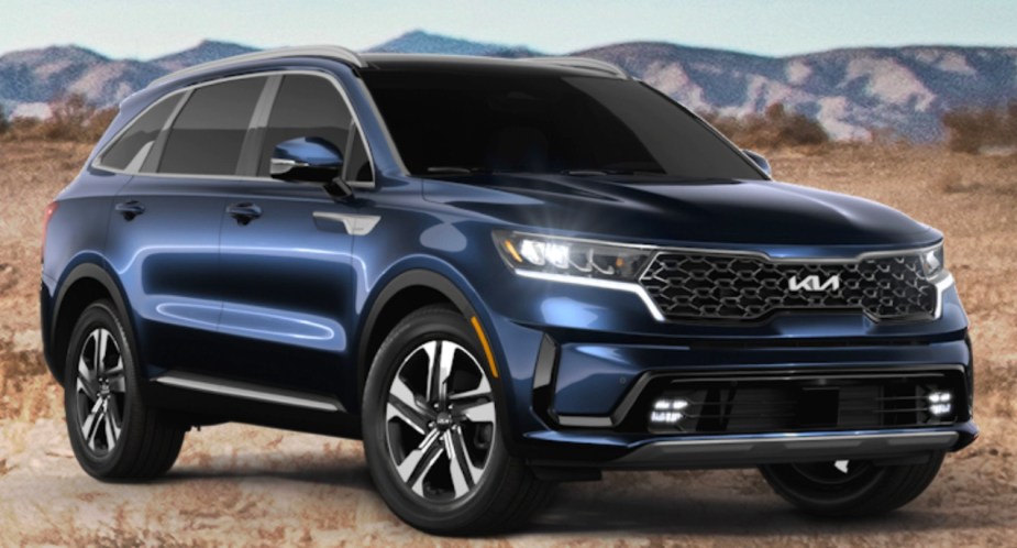 A blue 2023 Kia Sorento Hybrid midsize hybrid SUV is parked. 