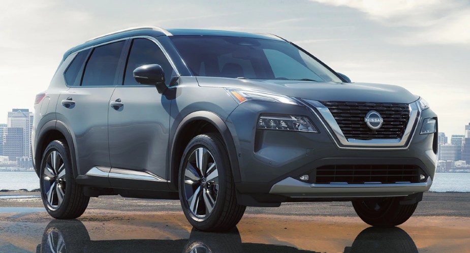 A gray 2023 Nissan Rogue small SUV is parked. 