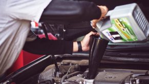 A mechanic conducting an oil change