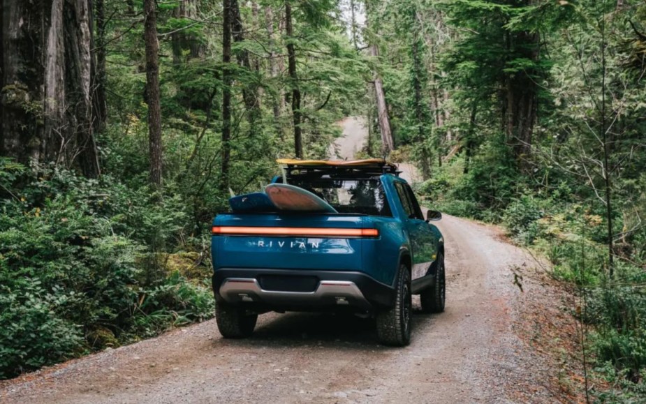 Rear angle view of blue 2023 Rivian R1T EV truck