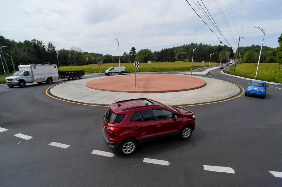 A roundabout with cars on it.