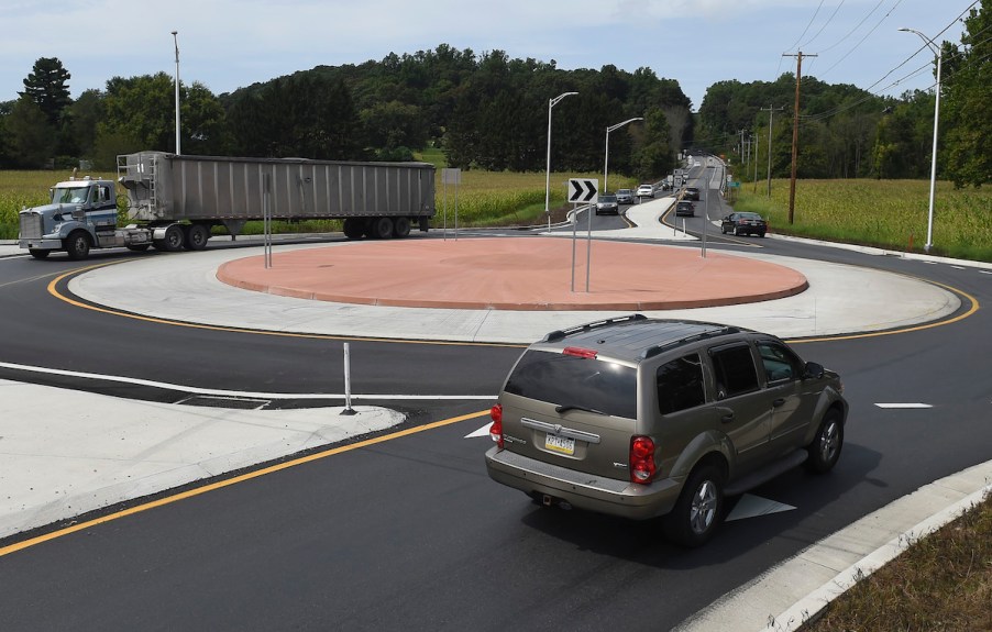 A roundabout with cars on it.