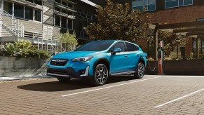 A 2023 Subaru Crosstrek Hybrid shows off as a hybrid SUV as its charged.