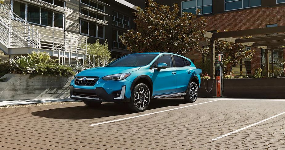 A 2023 Subaru Crosstrek Hybrid shows off as a hybrid SUV as its charged.