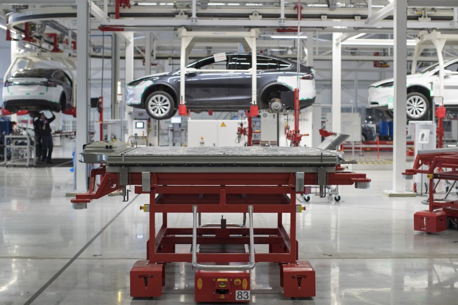 The tray of lithium-ion battery cells for a Model X sitting on a jack in the Tesla factory before being installed in an EV.