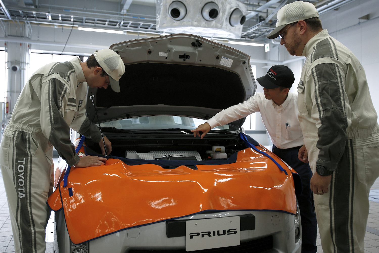 Toyota dealership technicians in training learn how to replace a Prius hybrid high-voltage battery.