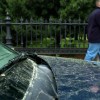 A car sits covered in pollen