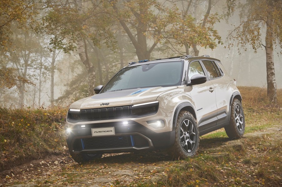 A silver Jeep Avenger in the woods