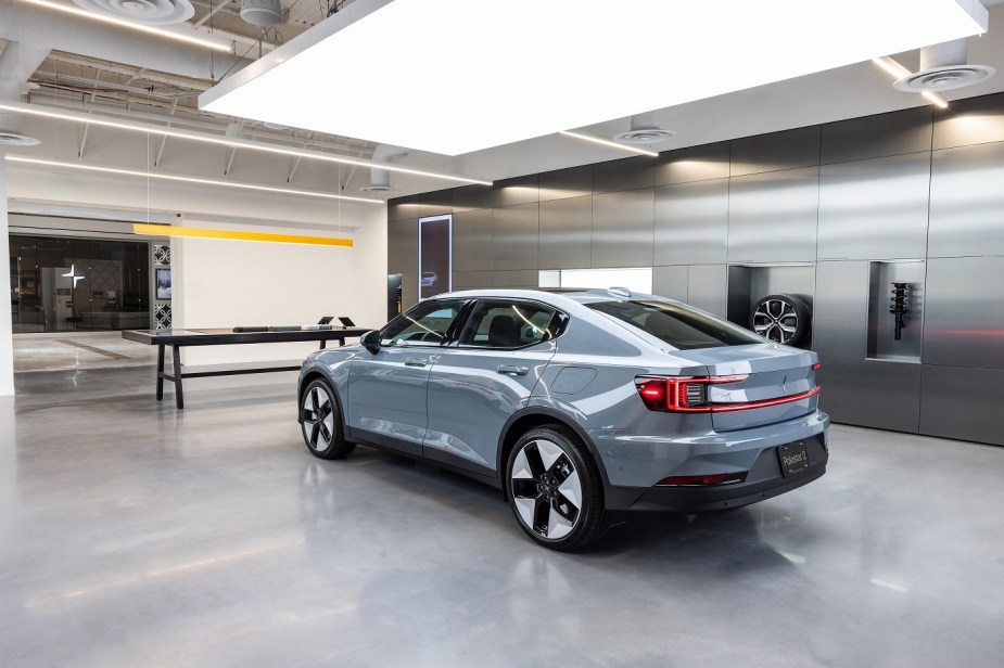 A silver Polestar2 in a showroom