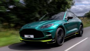 A green teal Aston Martin DBX luxury SUV model