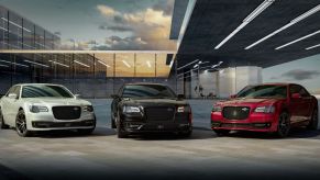 White, black, and red 2023 Chrysler 300C full-size performance sedan models