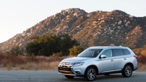 A silver 2017 Mitsubishi Outlander small SUV parked