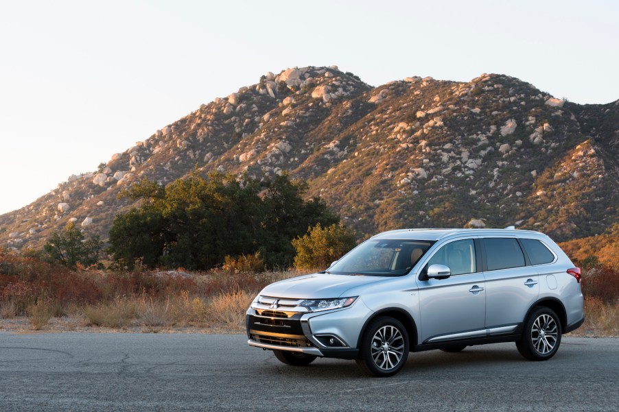 A silver 2017 Mitsubishi Outlander small SUV parked