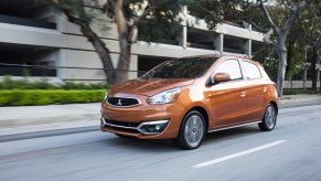 An orange 2019 Mitsubishi Mirage driving